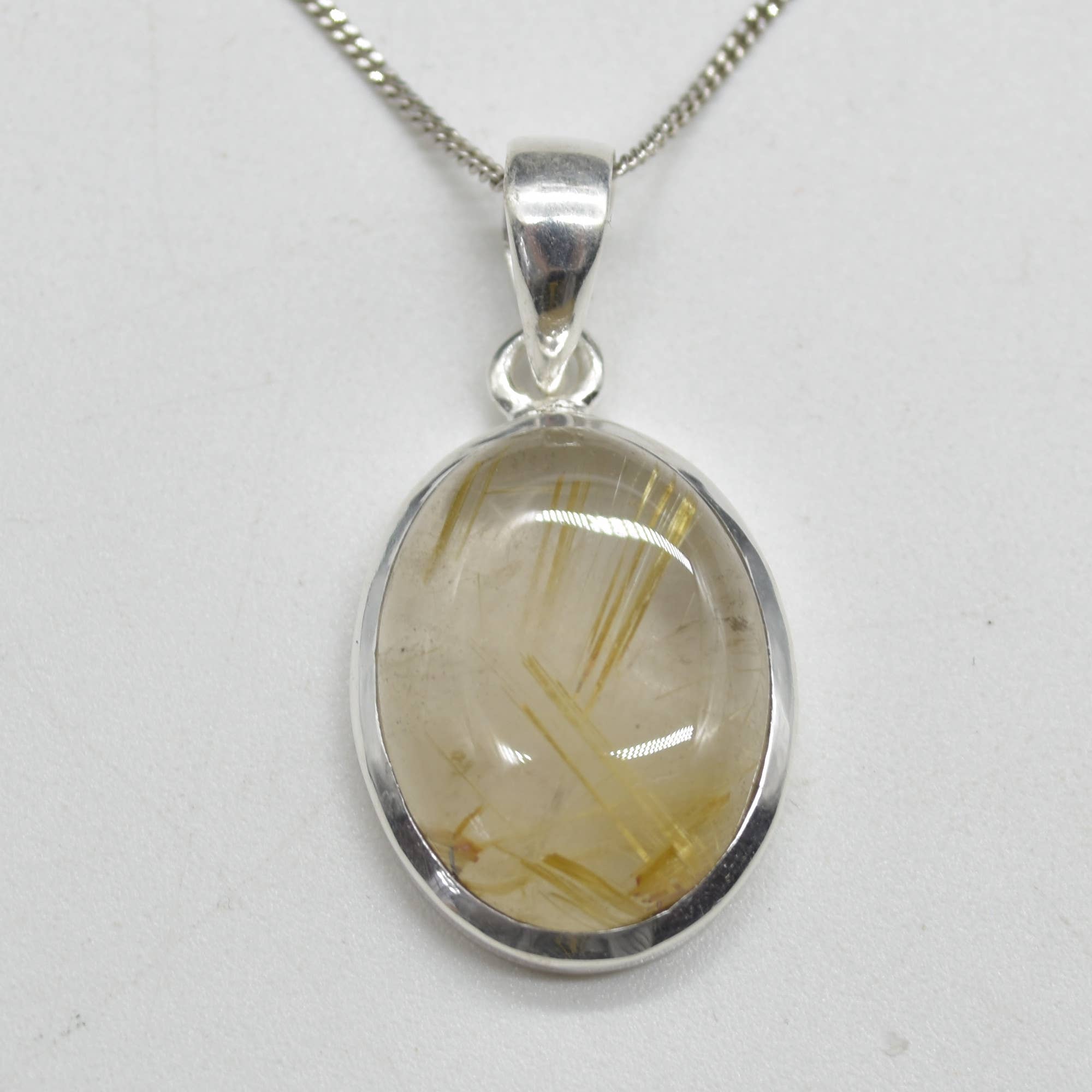 Golden Rutilated Quartz Oval Pendant in Sterling Silver