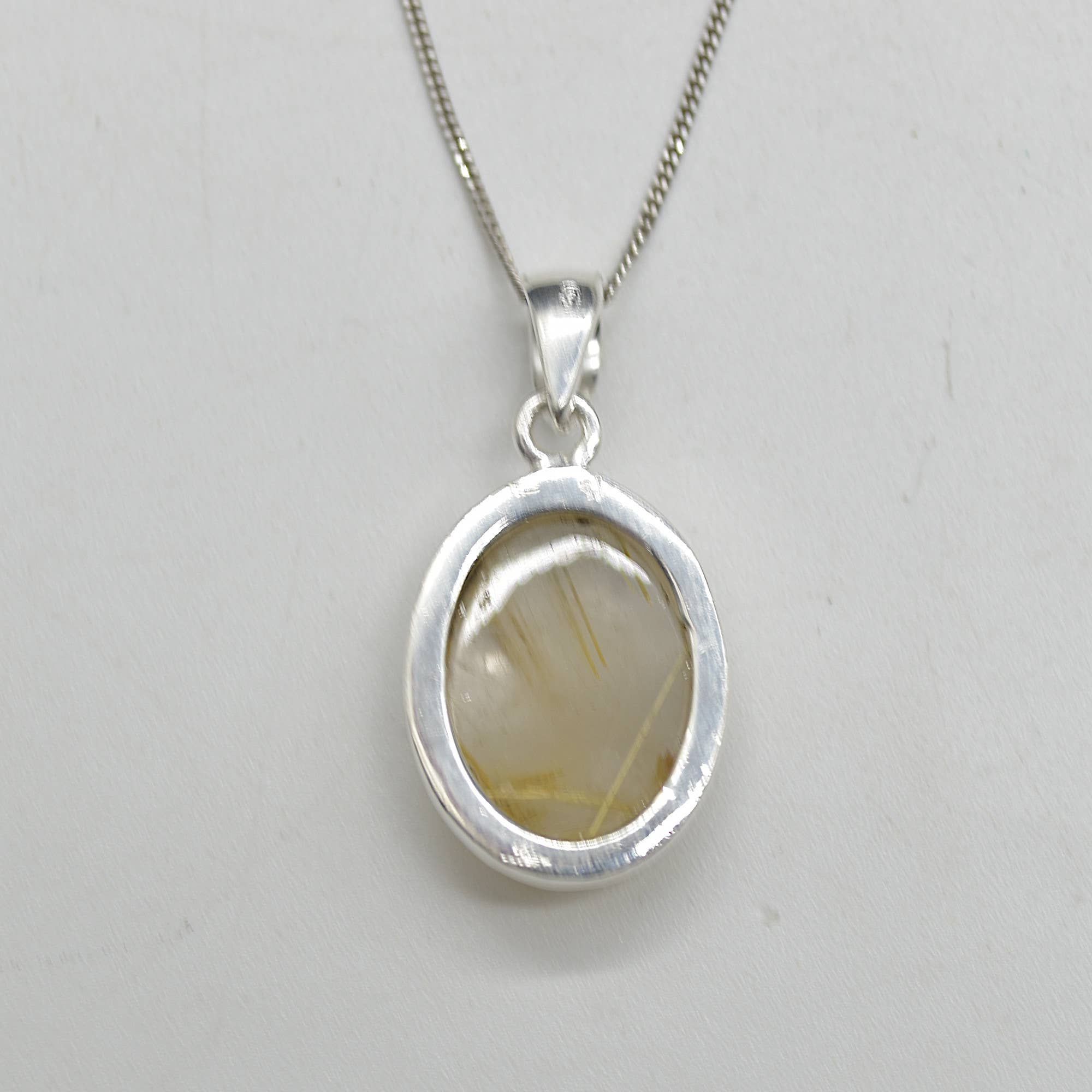 Golden Rutilated Quartz Oval Pendant in Sterling Silver
