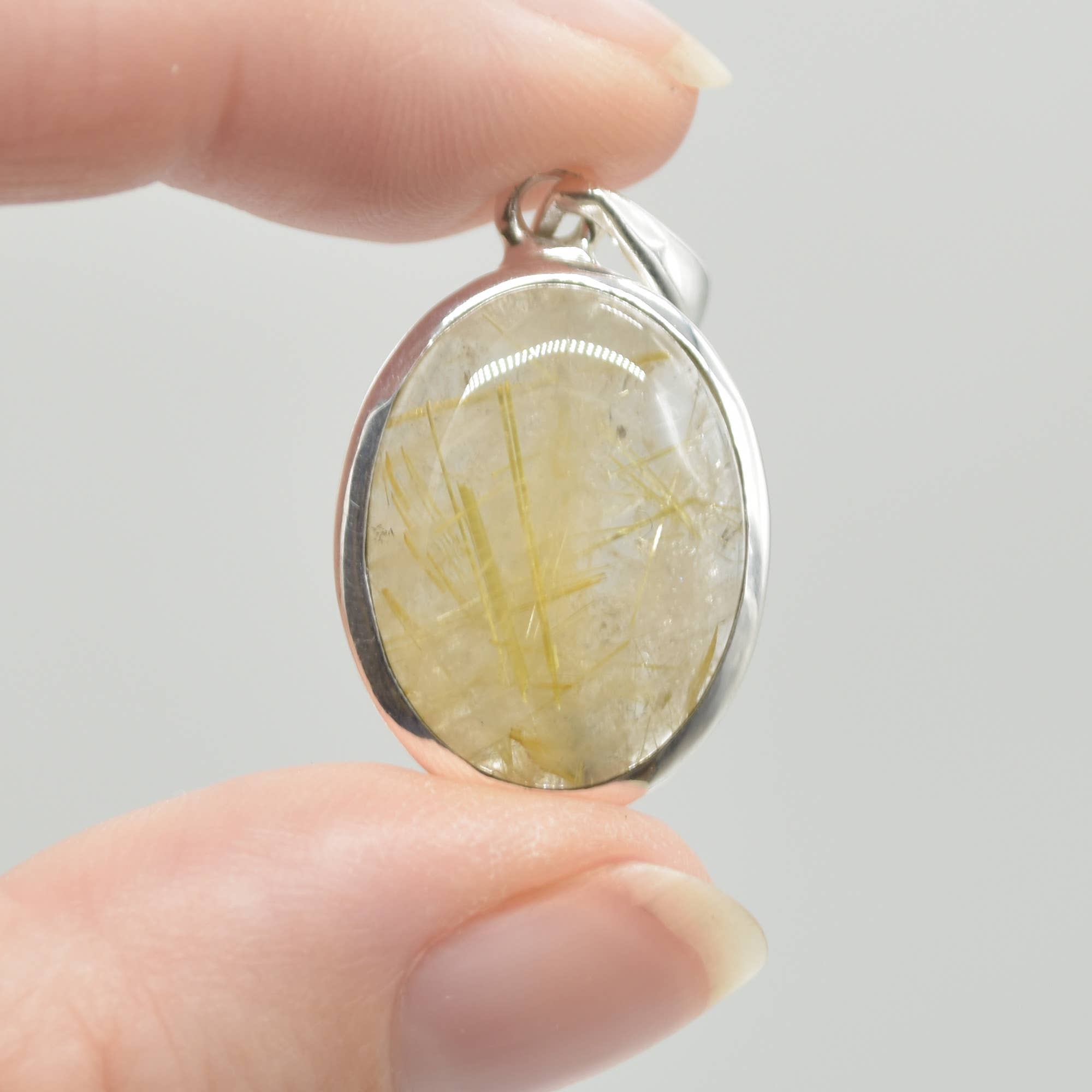 Golden Rutilated Quartz Oval Pendant in Sterling Silver