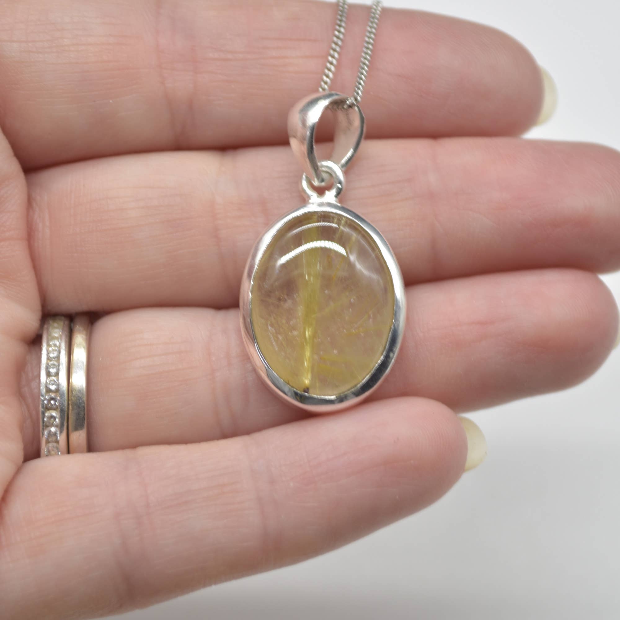 Golden Rutilated Quartz Oval Pendant in Sterling Silver